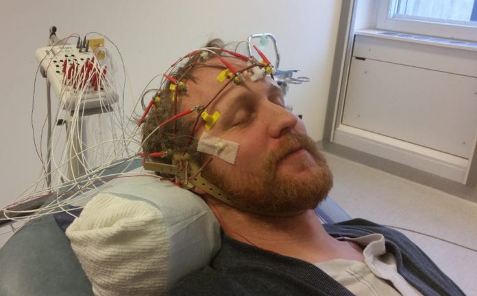 Close-Up of Young Man With Medical Equipment in Bed at Hospital Ward