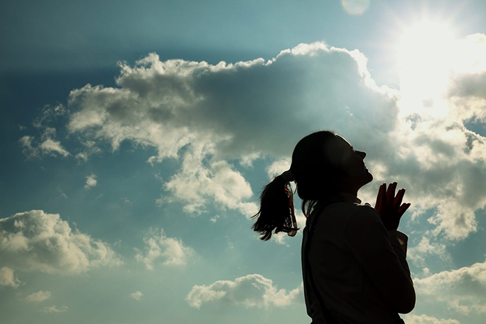 Silhouette of a woman on a sunny day