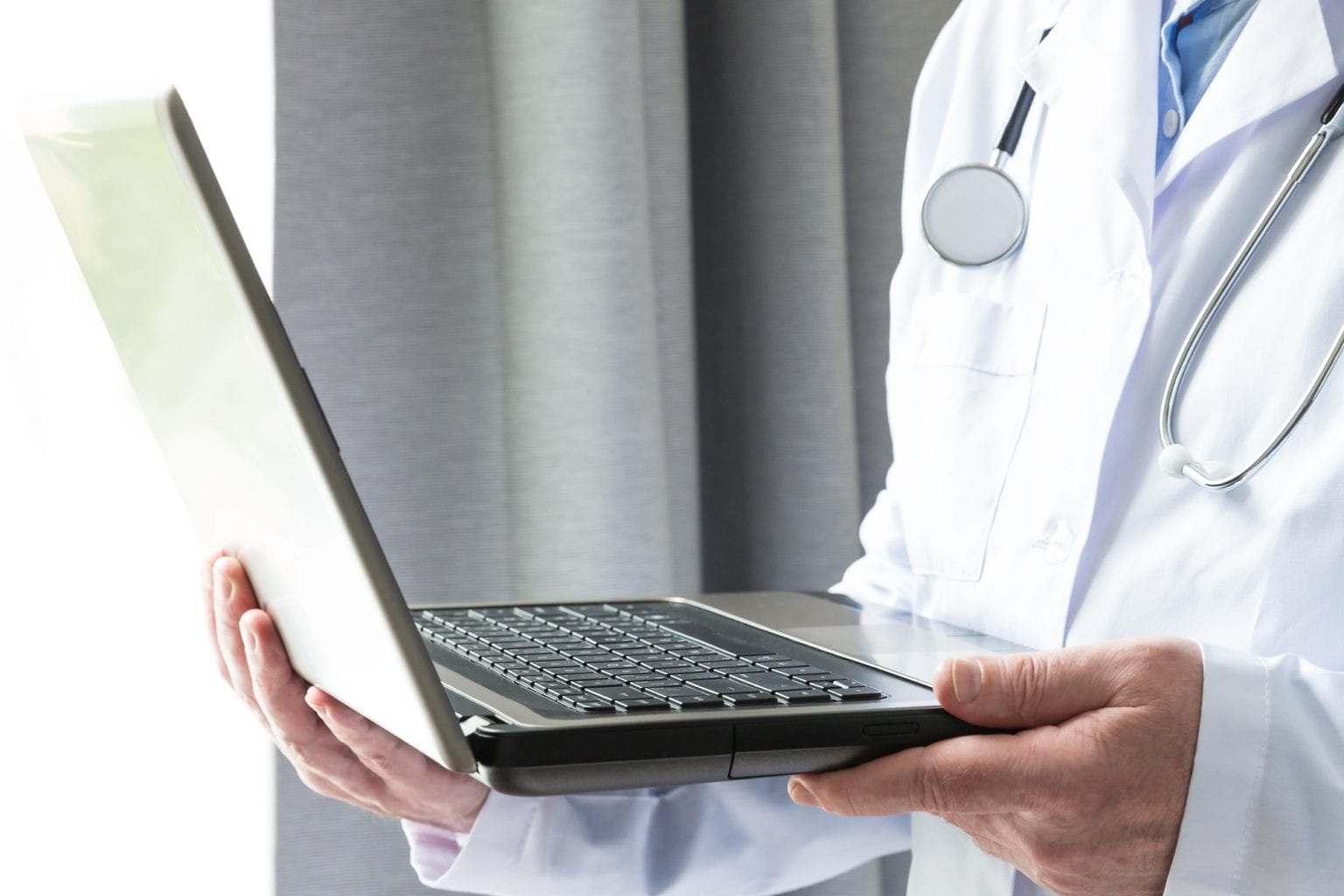 Doctor with laptop computer