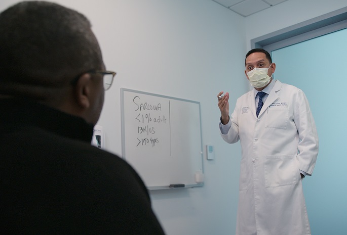 dr cardona of winship cancer institute with sarcoma patient