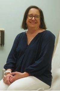 Cindy, cancer clinical trials patient, smiles at camera