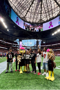 Chrystal and her family at Crucial Catch game 2025