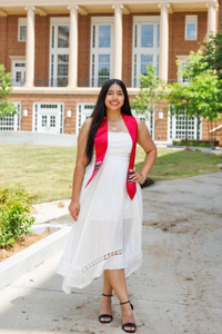 Patient Simrit poses on graduation day after her ankle tumor surgery