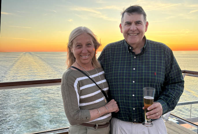 patient jack and his wife barbara on a boat at sunset