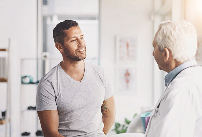 A man talking to his physician