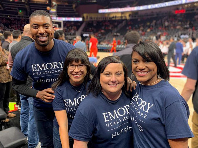emory employees courtside at a game