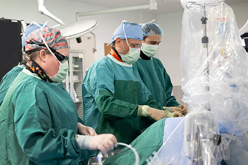 three emory medical professionals in an operating room