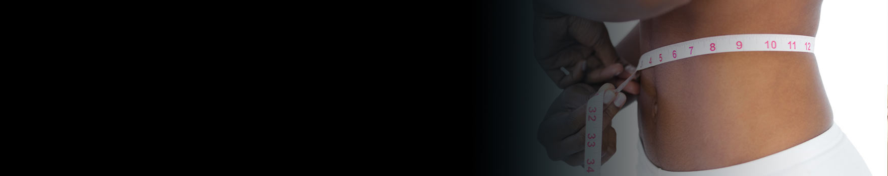 Woman measuring her waist