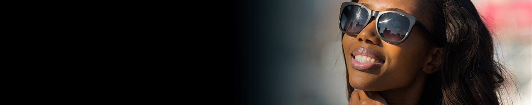 Woman smiling with shades on