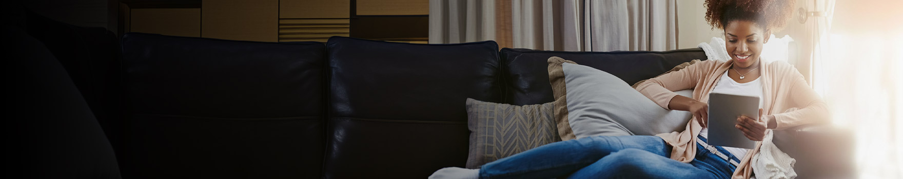 Woman on sofa with tablet