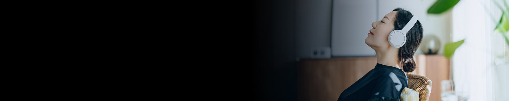 Woman with her eyes closed with headphones