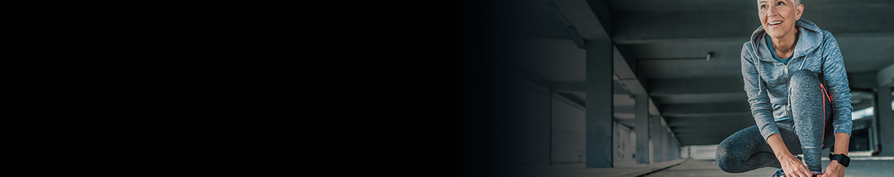 Woman tying her shoes to exercise