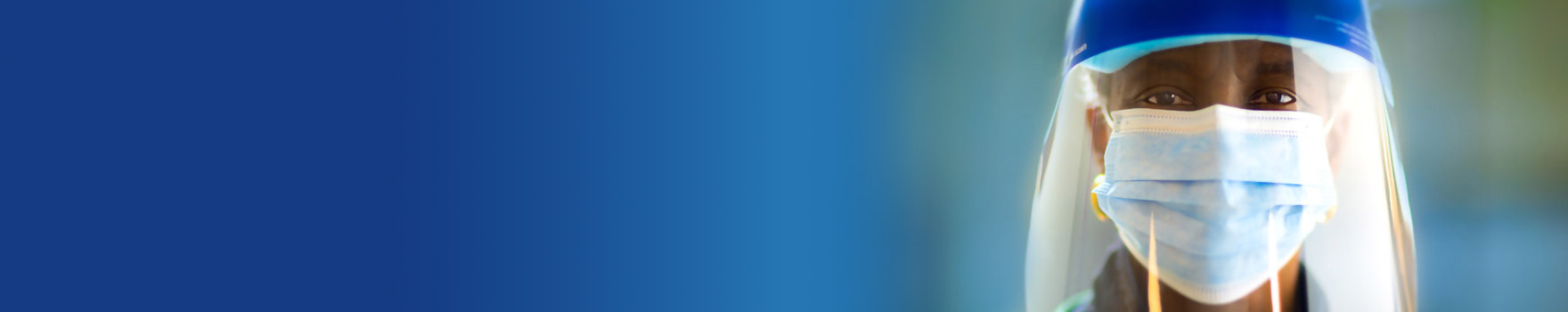 medical professional wearing mask and face shield