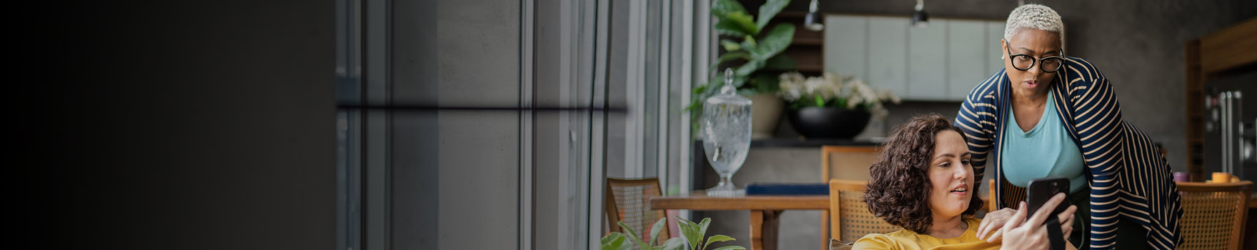 Women looking on mobile device