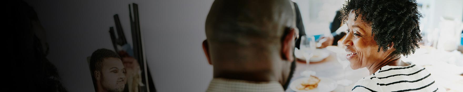 Friends sitting casually and laughing at a restaurant