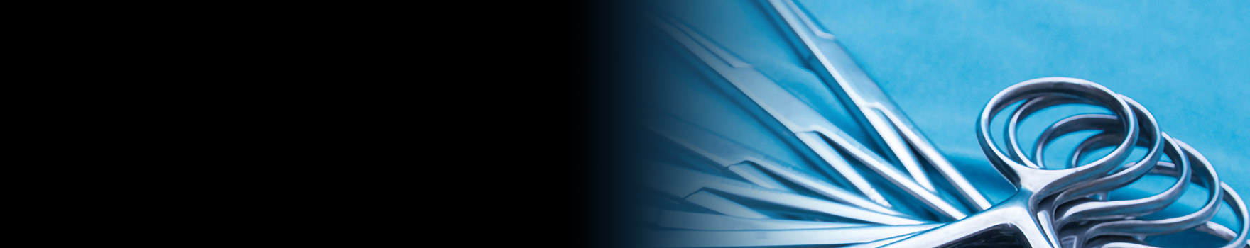 black gradient over image of surgical scissors