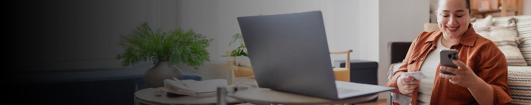 Woman checking her phone with a casual smile
