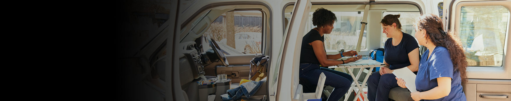 A group of women inside a minivan