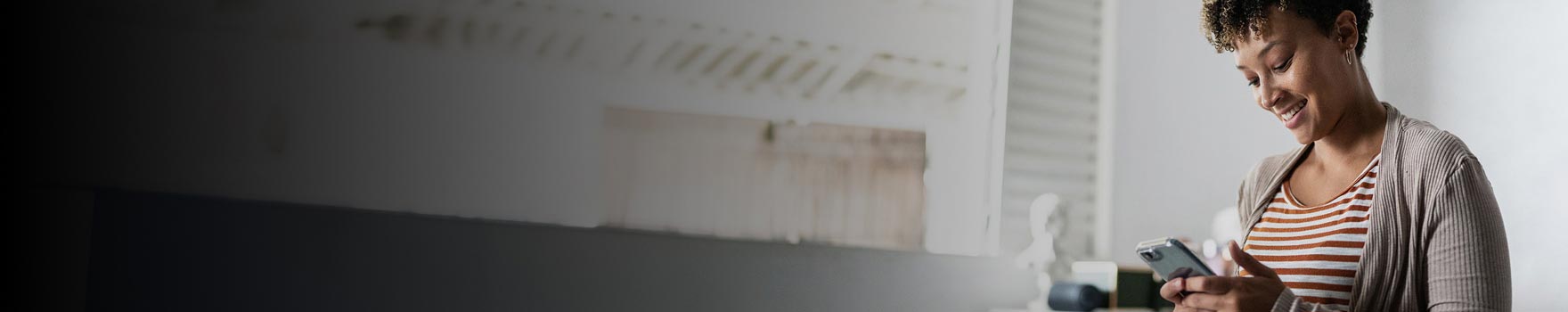 Woman sitting comfortably and scrolling through her phone