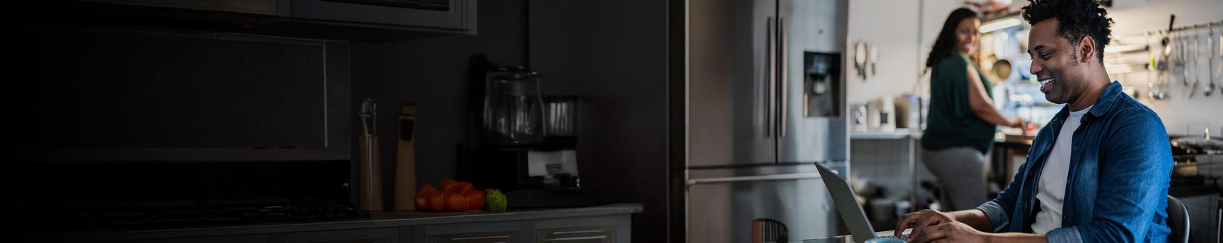 Man sitting casually and working on his computer