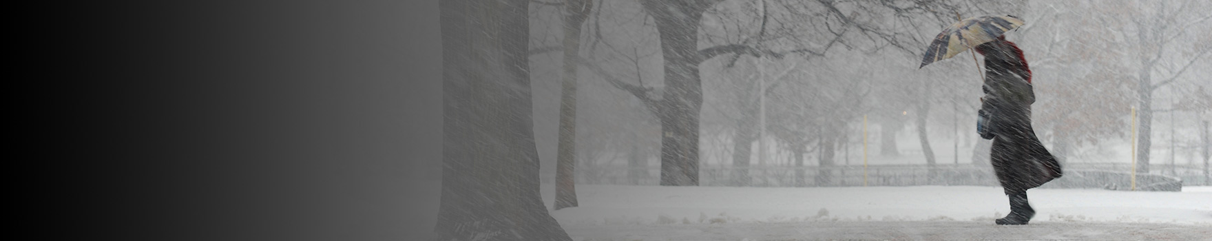 Woman walking outdoors during a winter storm