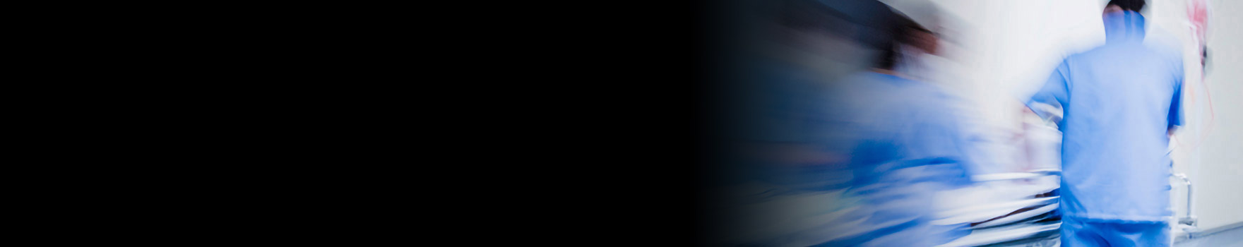 nurses rushing stretcher in hospital