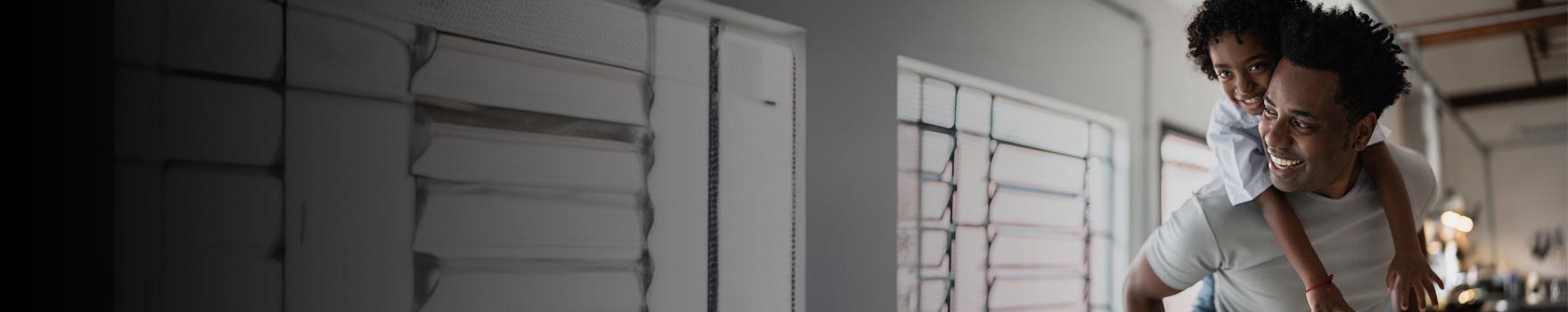 Father and daughter playing in the living room