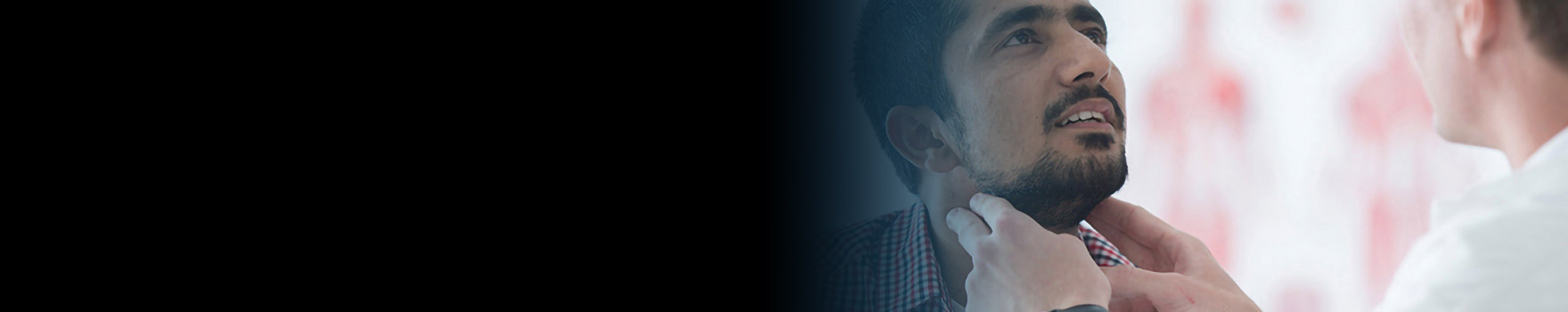 doctor checking man's neck with his hands