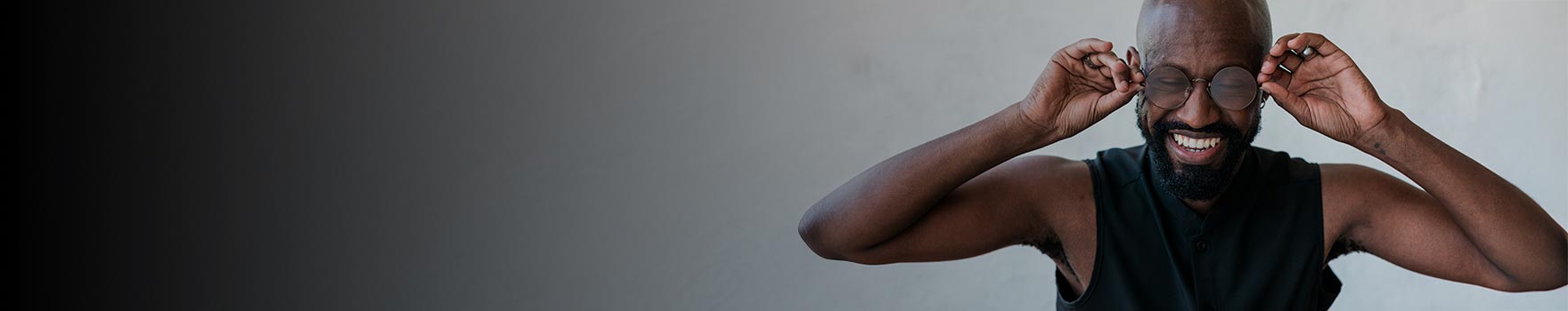 man wearing glasses and smiling