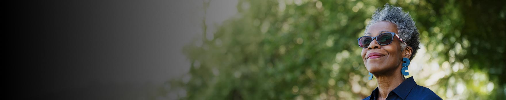 elderly woman wearing sunglasses outdoors