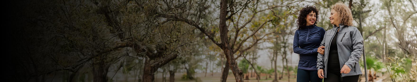 two women walking outdoors