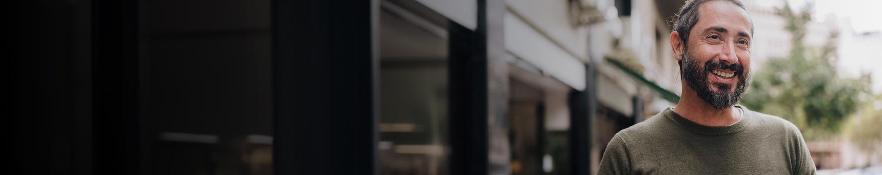 Man smiling and looking at the sunset