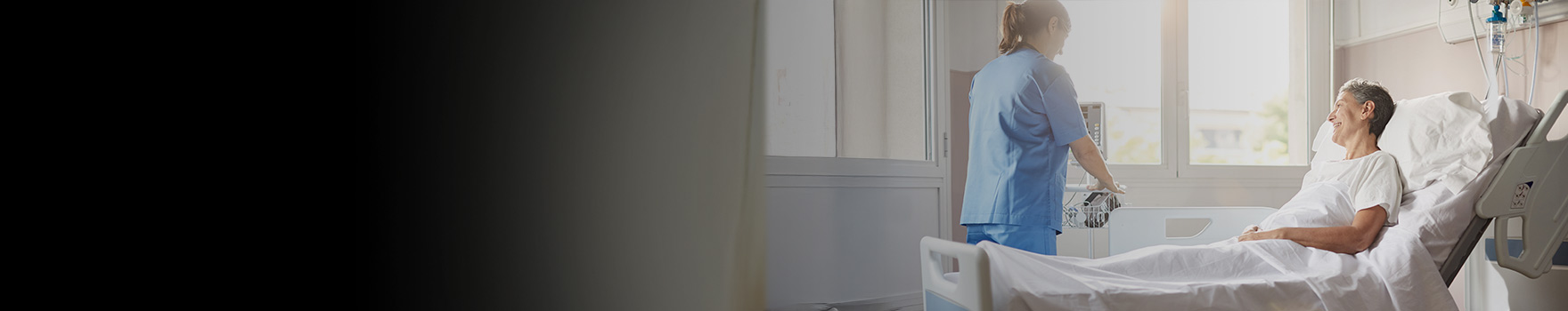 Nurse and patient inside a hospital room