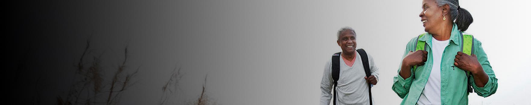 woman looking back at her husband while hiking