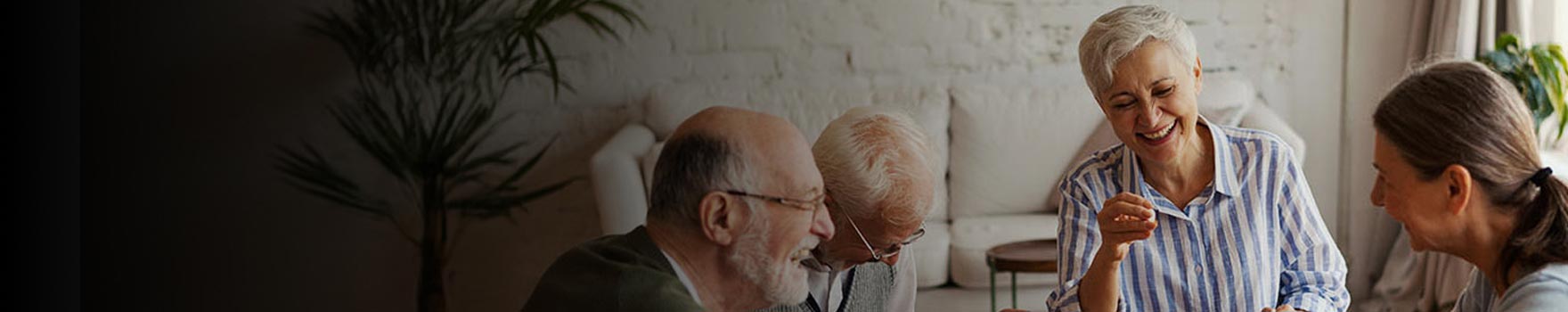 older people playing a boardgame