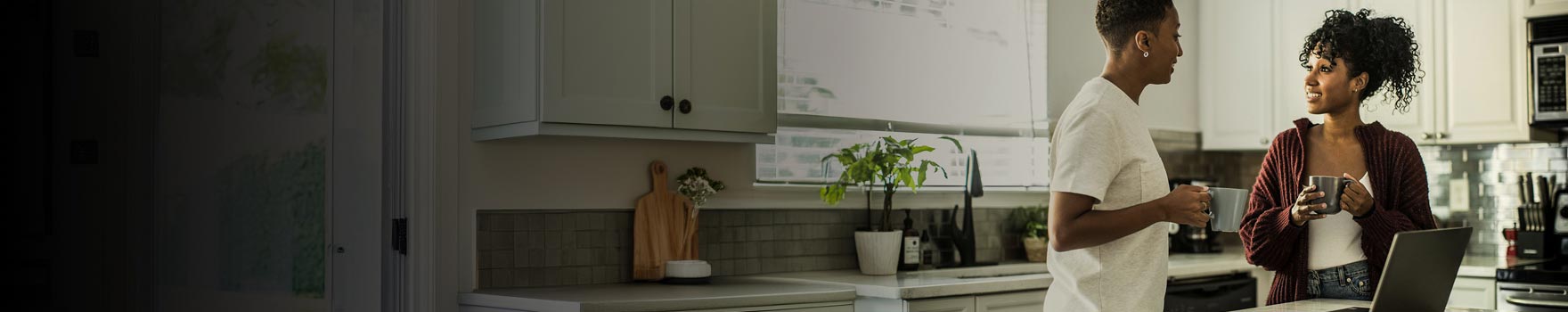 Two women having a conversation at home