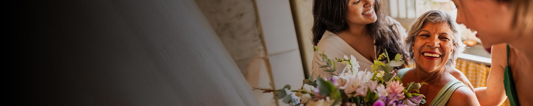 A group of women inside a home getting ready for a wedding