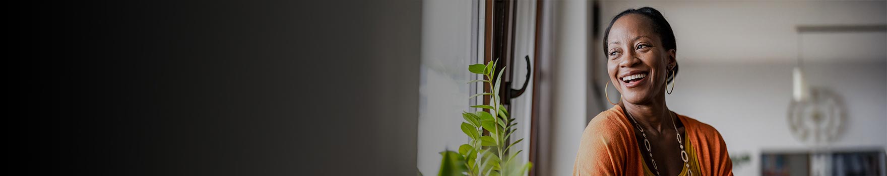 A woman looking out the window and smiling
