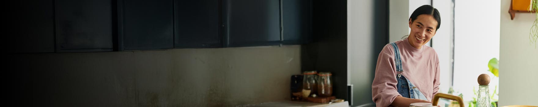 A young asian woman in a kitchen