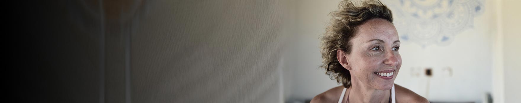 A happy woman smiling outdoors