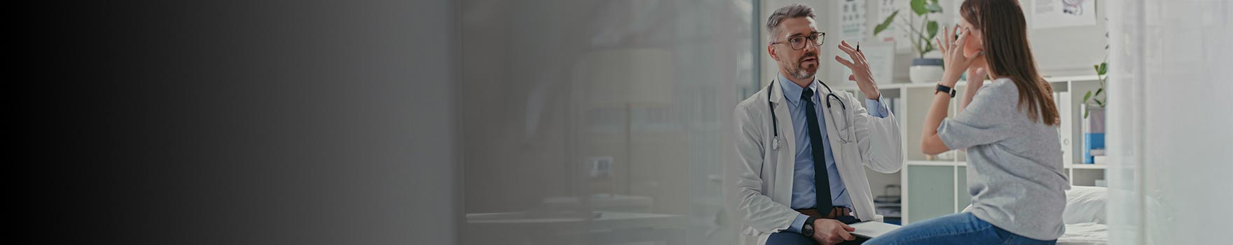 Doctor and patient inside a clinic discussing the visit