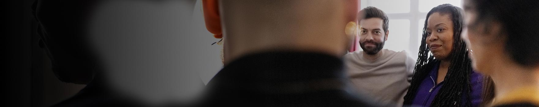 A group of people inside a classroom setting