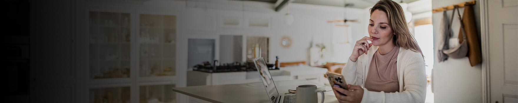 Woman on her phone checking her account online