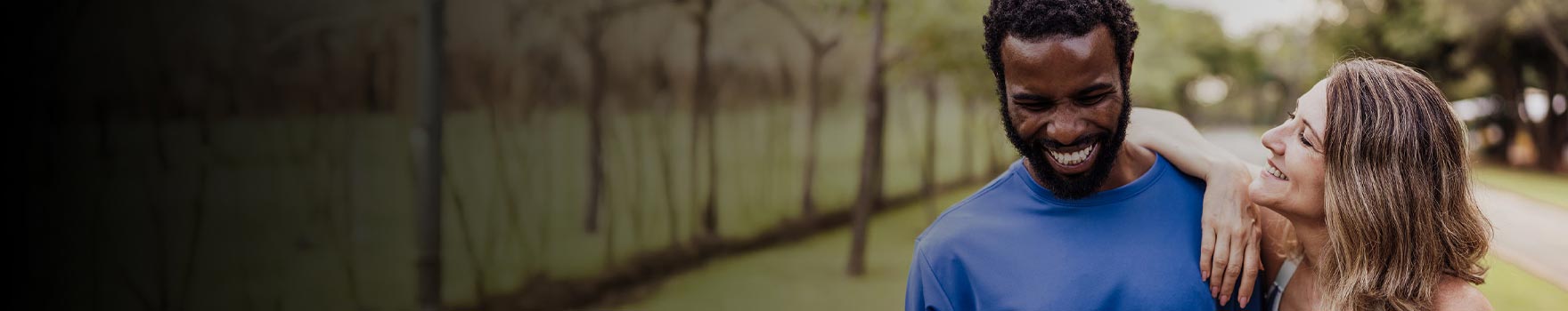 woman speaking with man as he laughs