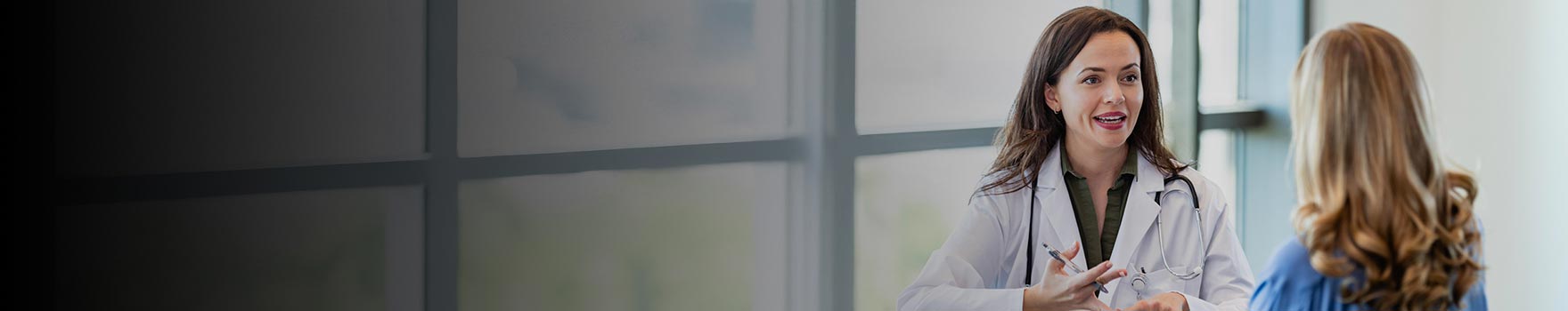 Woman speaking with physician