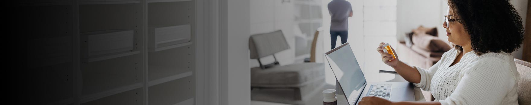 Woman looking at her prescription bottle
