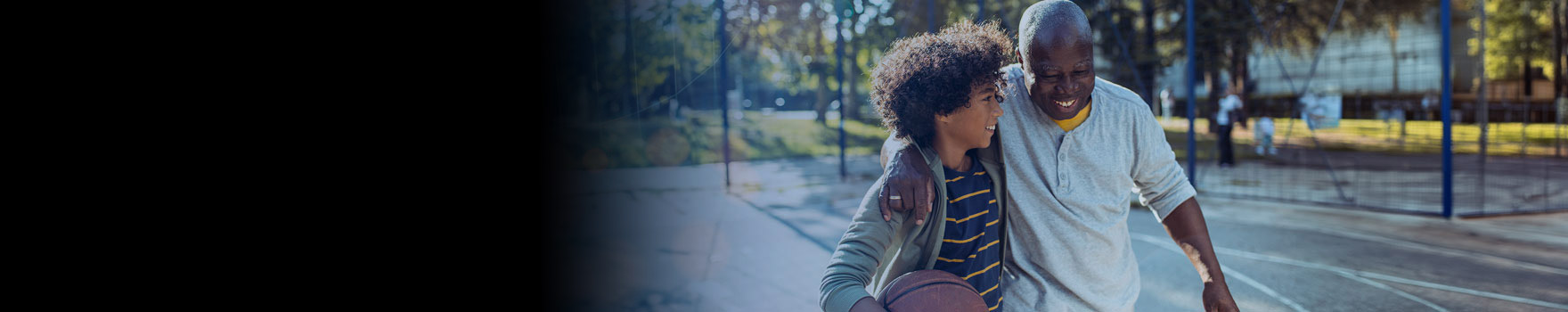 father and son on a basketball court