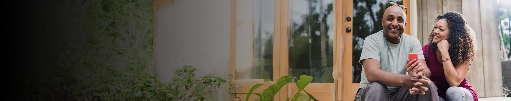 Man and woman sitting outside