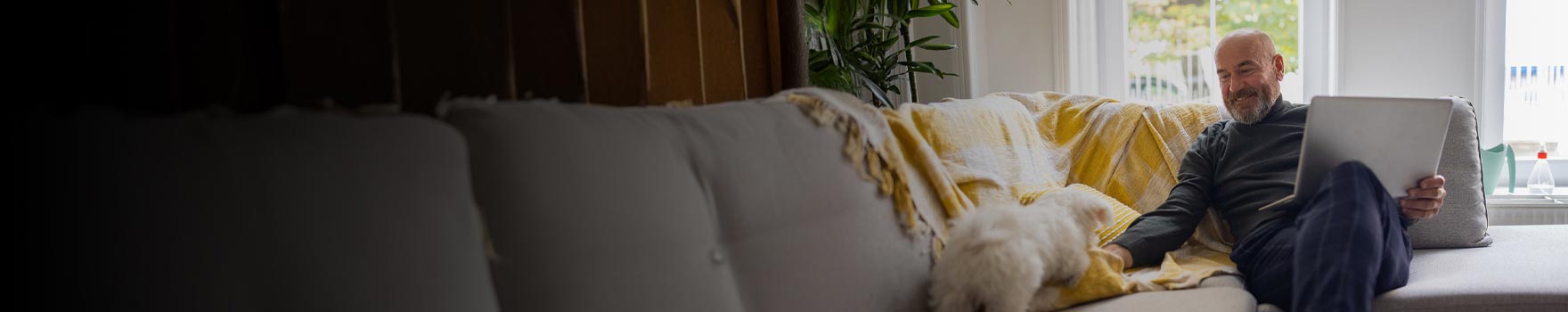 Man on a laptop in his home