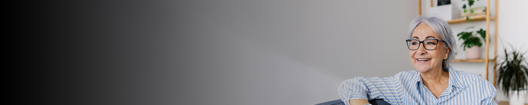 elderly woman sitting on a sofa